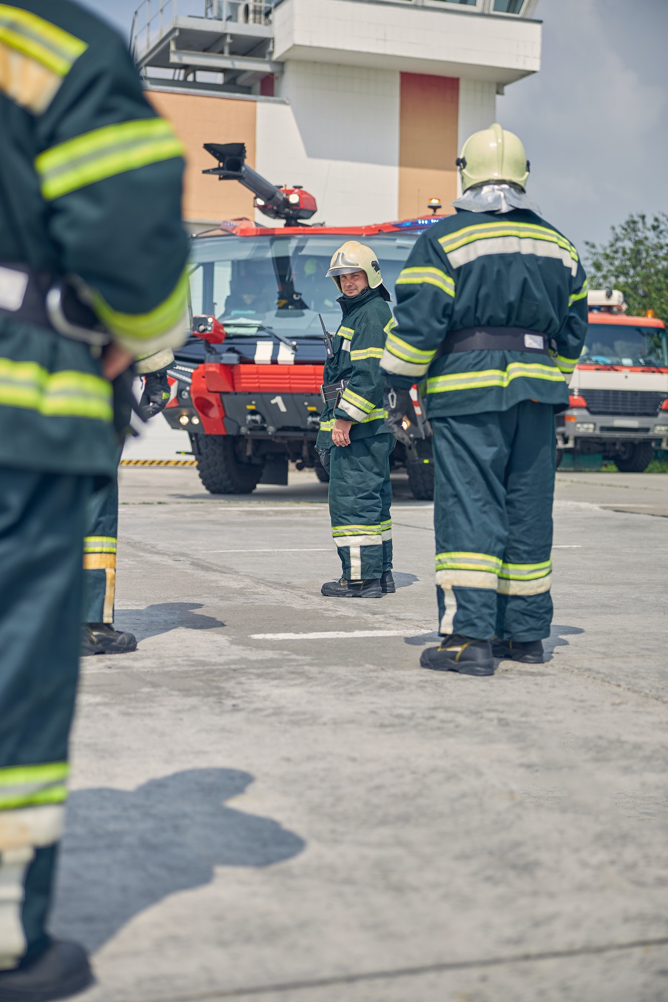 men-going-to-the-red-fire-truck-in-the-outdoors.jpg